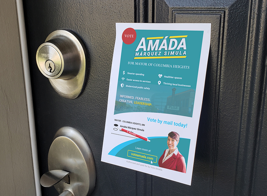 Political campaign literature attached to a door with 3M adhesive.